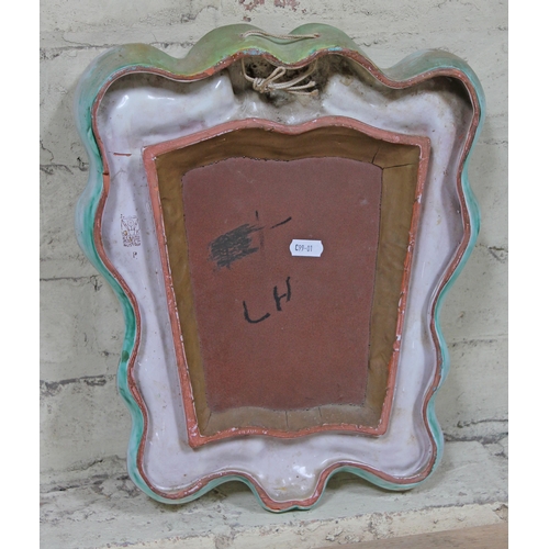 400 - An Austrian 1930s Art Deco pottery mirror with theatrical masks, Gmundner Karamik, length 37cm.