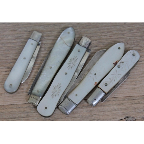 409 - A group of five hallmarked silver bladed penknives.