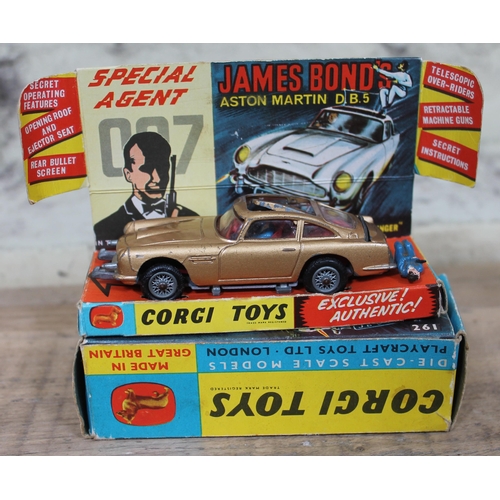 413 - A mixed lot of toys including a Corgi Toys 261 James Bond DB5, a Corgi Toys 253 Mercedes-Benz 220 SE... 