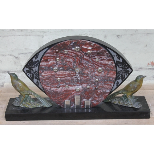 416 - An Art Deco marble clock with spelter birds, length 49.5cm, later electric movement.