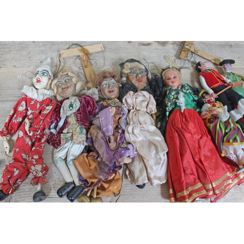 440 - A group of four papier mache puppets and four other dolls.