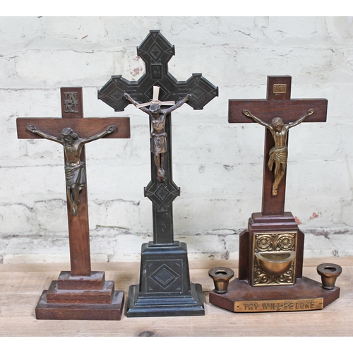 72 - A group of three crucifixes, tallest 50cm.