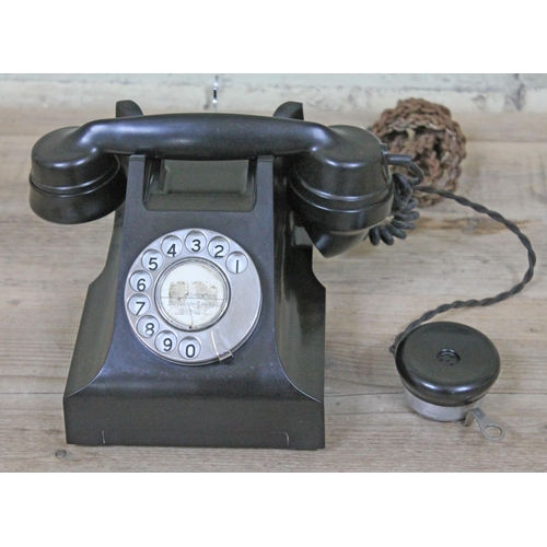 447 - A black bakelite telephone.