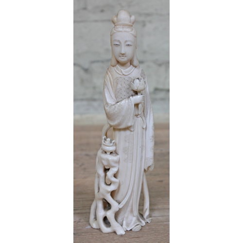 479 - A Japanese Meiji Period one piece carved ivory Okimono, signature to base, height 24cm.