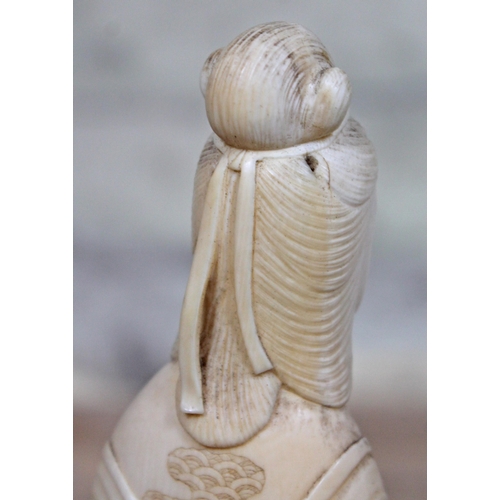 479 - A Japanese Meiji Period one piece carved ivory Okimono, signature to base, height 24cm.