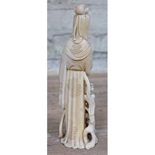 479 - A Japanese Meiji Period one piece carved ivory Okimono, signature to base, height 24cm.