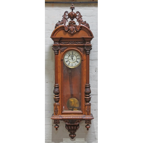 84 - A German 19th Century walnut Vienna wall clock by Gustav Becker, length 150cm.