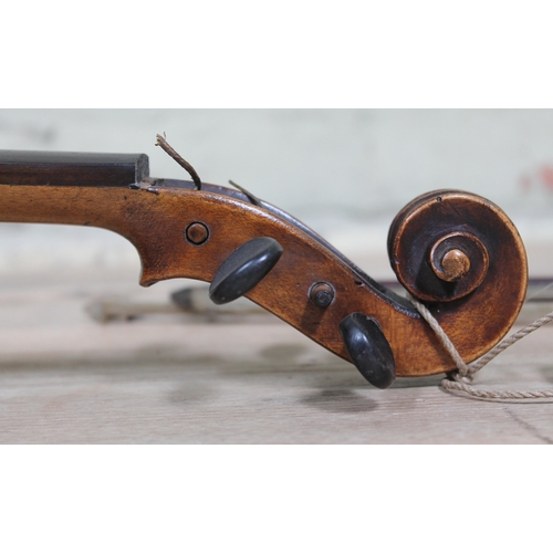 86 - A 19th Century violin and two bows.