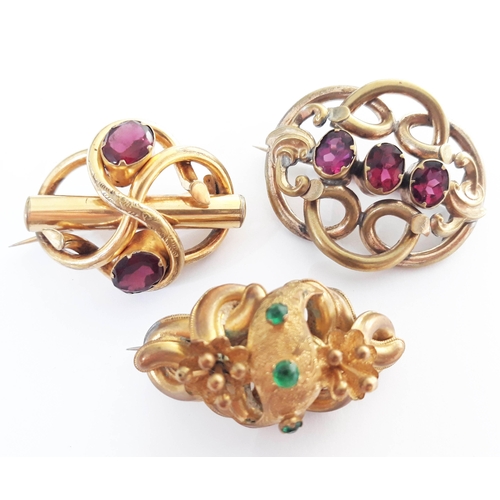 106 - A mixed lot of 19th century yellow metal jewellery consisting three brooches set with colour stones ... 