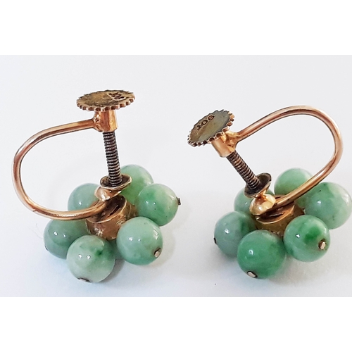 108 - A pair of gold and jade bead earrings, each with 7 small jade beads, diameter between 4-5 mm each, c... 