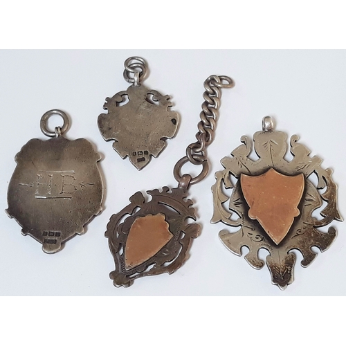 110 - A group of four hallmarked silver fobs, gross weight 67.8g.