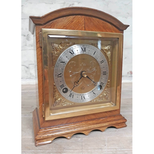 67 - An Elliot domed top mantle clock with brass and steel dial, height 20cm.