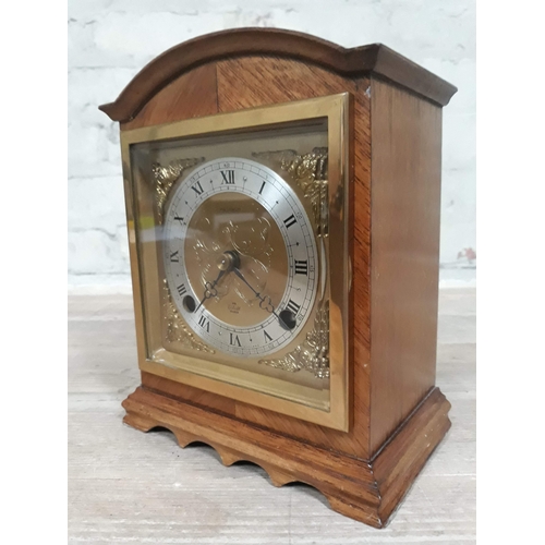 67 - An Elliot domed top mantle clock with brass and steel dial, height 20cm.