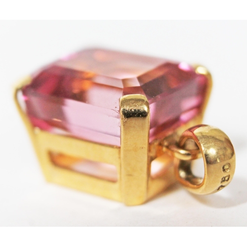 100 - A single stone natural tourmaline pendant, approx. 12 carats, mount marked '750', length 2.1cm, gros... 