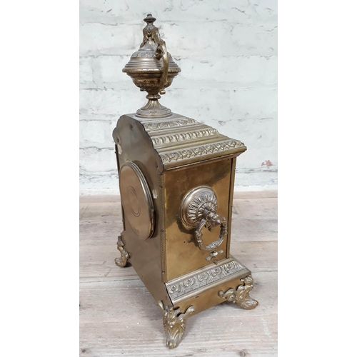 69 - A French late 19th Century gilt brass mantle clock with enamel dial, height 39cm.