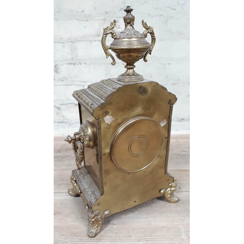 69 - A French late 19th Century gilt brass mantle clock with enamel dial, height 39cm.