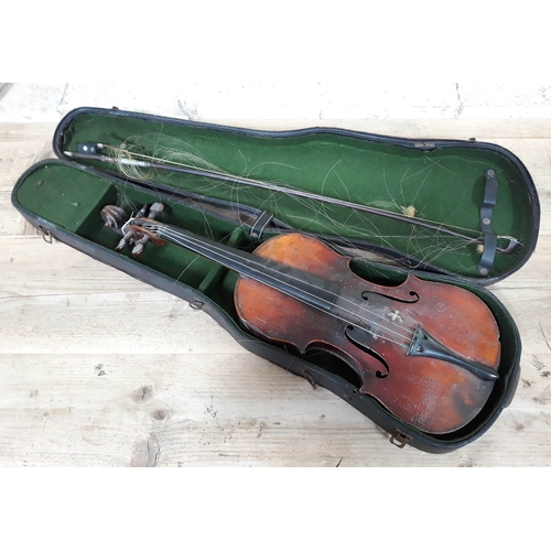 81 - A 19th Century German violin, length of back 37cm, cased with a single bow.