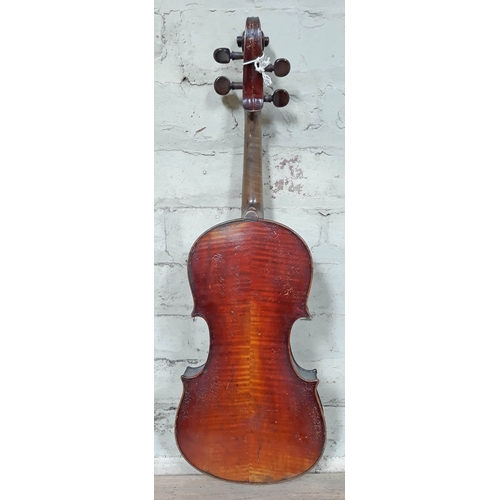 81 - A 19th Century German violin, length of back 37cm, cased with a single bow.