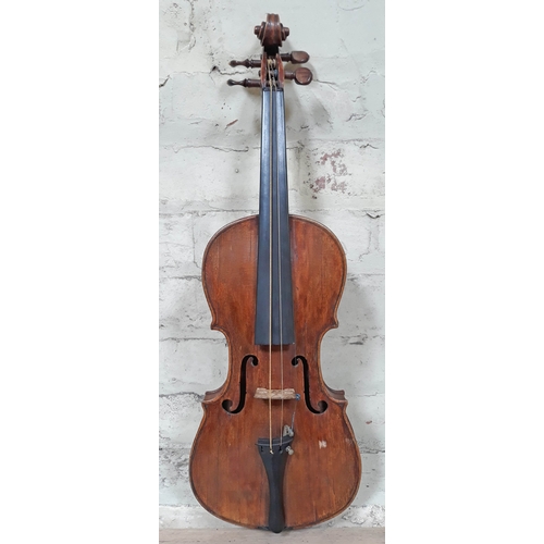 84 - A 19th Century violin, probably Italian, length of back 36cm, with hard case and interesting receipt...
