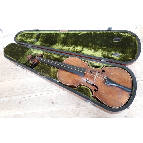 84 - A 19th Century violin, probably Italian, length of back 36cm, with hard case and interesting receipt... 