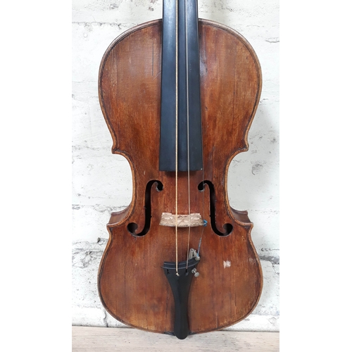 84 - A 19th Century violin, probably Italian, length of back 36cm, with hard case and interesting receipt... 