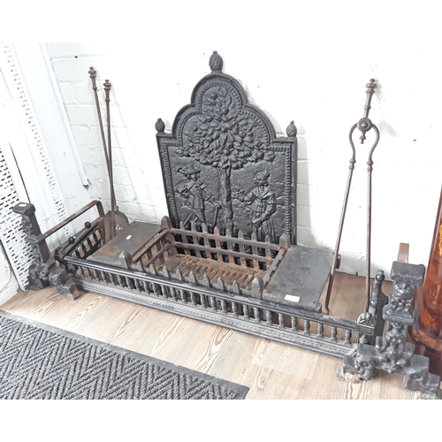 94 - Various fireplace items comprising a cast iron back plate, grate, fender, a pair of dogs and tools.