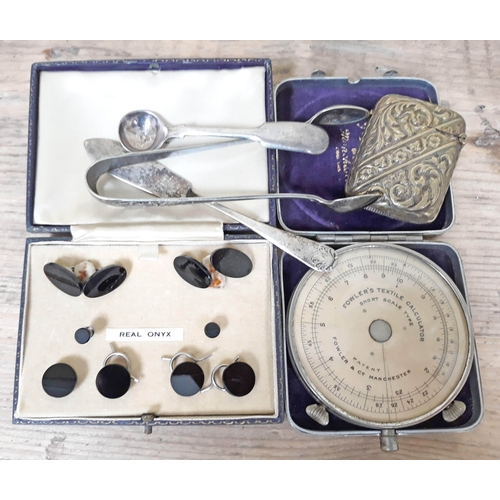 98 - A mixed lot to include a Fowler's textile calculator, black onyx cufflink set and various plated war... 