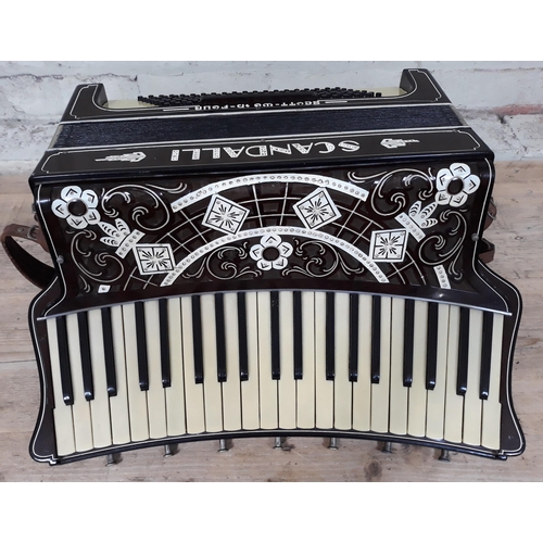 375 - An Italian Scandalli accordion, curved keyboard with 7 couplers, inscribed '5039 Camerano Italia' to... 