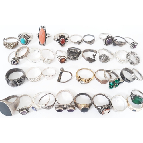 122 - A group of 39 silver rings, various silver marks, various stones including coral etc. gross weight 1... 