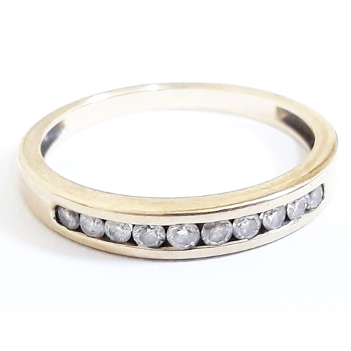 103 - A 10 stone diamond ring, hallmarked 9ct gold band, gross wt. 1.9g, size N.