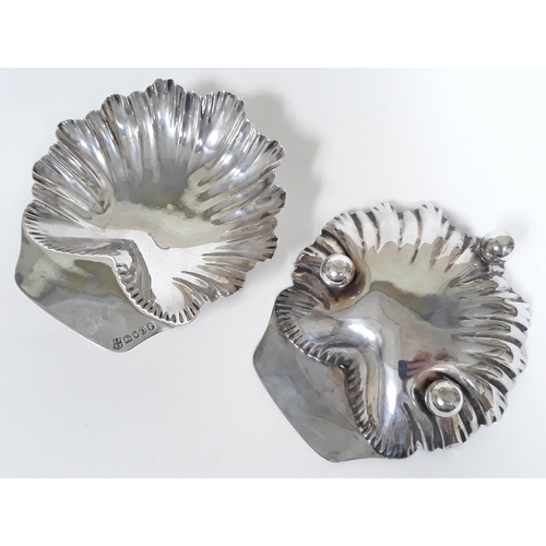 116 - A pair of Victorian silver half clam dishes on three feet, Horace Woodward & Co, London 1889, length... 