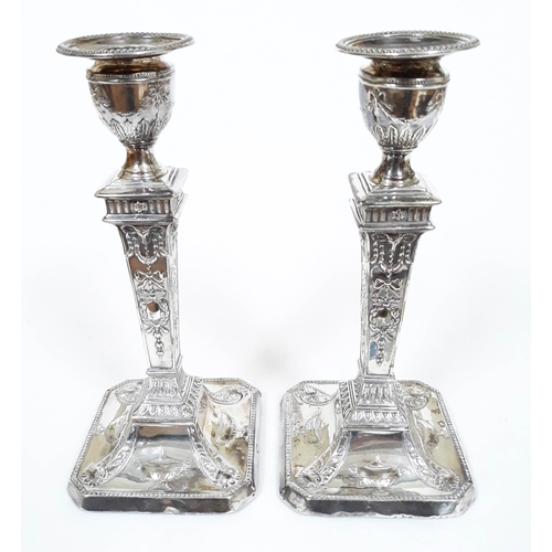 117 - A pair of Neo-Classical style silver candlesticks, Walter Latham & Son, Sheffield 1899, height 20cm.