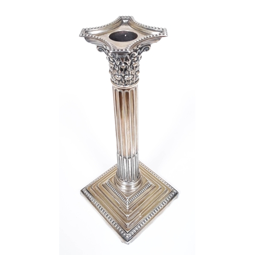 120 - A Hallmarked silver Corinthian column candle stick, height 24cm.