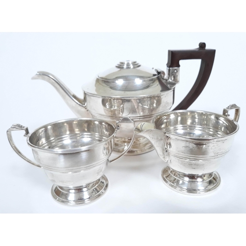 125 - A three piece hallmarked silver tea set, gross wt. 13 1/2oz.