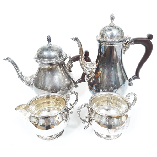 147 - A four piece Georgian style hallmarked silver tea set, gross wt. 54oz.