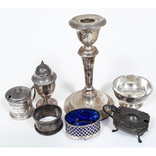 152 - A mixed lot of hallmarked silver comprising a candlestick, a bowl, a napkin ring and various part cr... 