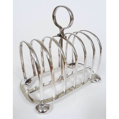 155 - An Edwardian silver toast rack, Walker & Hall, Sheffield 1904, length 15.2cm, wt. 9 1/2oz.