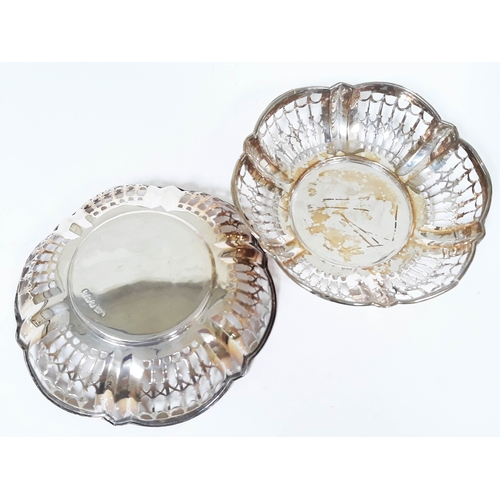 160 - A pair of pierced silver dishes, Walker & Hall, Sheffield 1916, diam. 11.5cm, wt. 2 1/2oz.