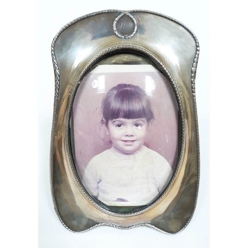 166 - An Edwardian hallmarked silver photo frame, length 20cm.