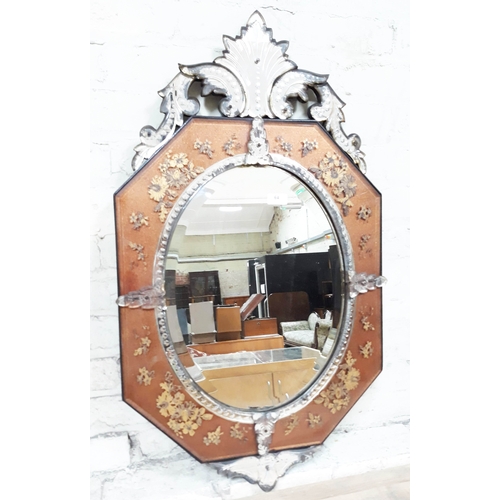 64 - A 19th century Continental wall mirror with gilded decoration, height 95cm width 55cm.