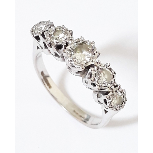 185 - A five stone diamond ring, total approx. diamond wt. 0.65 carats, hallmarked 18ct white gold band, g... 