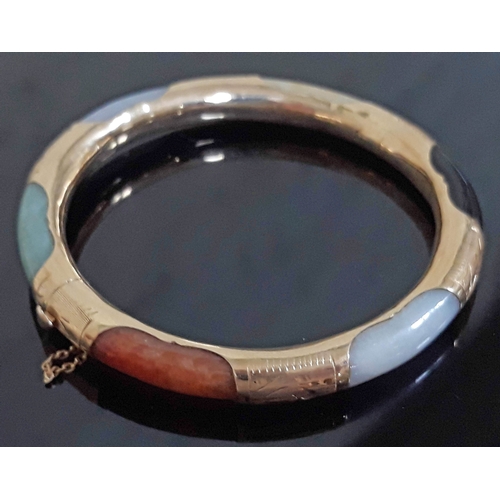 194 - A Chinese 14K multi-coloured jade bangle, marked '14K' & 585', diam. 7cm, wt. 27g.