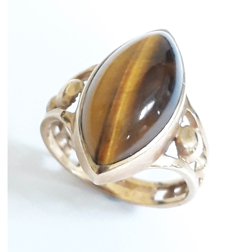 208 - A hallmarked 9ct gold ring set with a tiger's eye, gross wt. 4.4g, size M/N.