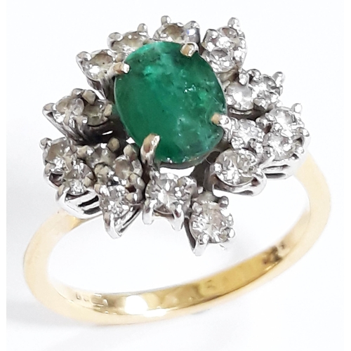 184 - An emerald and diamond cluster ring, the central stone measuring 7mm x 5mm x 3mm, 18ct gold import m... 