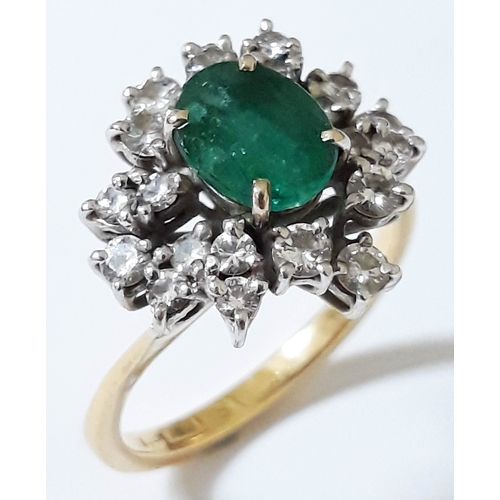 184 - An emerald and diamond cluster ring, the central stone measuring 7mm x 5mm x 3mm, 18ct gold import m... 