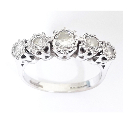 185 - A five stone diamond ring, total approx. diamond wt. 0.65 carats, hallmarked 18ct white gold band, g... 