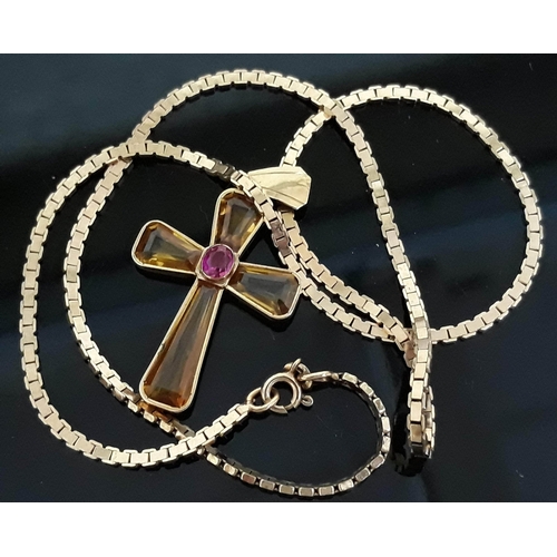 196 - A yellow metal yellow and pink stone crucifix pendant marked '585', length 45mm, on hallmarked 9ct g... 