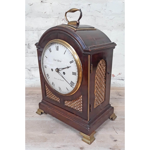 74 - A Regency bracket clock having dome top with gilt brass handle, gilt brass grille sides, painted dia... 