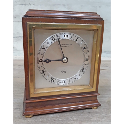 75 - An Elliott clock with retailers name Ollivant & Botsford Manchester to dial, height 16cm.