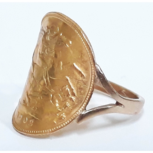 197 - A half sovereign ring, marked '9ct', gross wt. 5.2g.